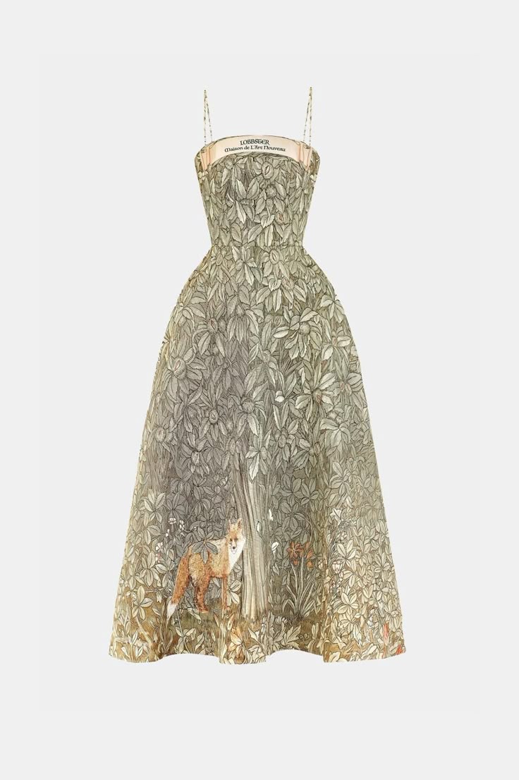the image shows a strapless midi dress with thin straps and a full skirt. the dress is printed with a dense pattern of leaves in shades of green and gray. at the bottom of the dress, a fox is depicted standing near a tree trunk. the dress appears to be designed by loris azzaro.