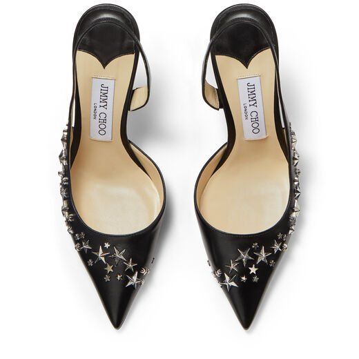 the image shows a pair of black leather jimmy choo slingback heels.  the heels are pointedtoe and feature a silver star embellishment across the vamp. the shoes are positioned on a white background, one shoe slightly angled to the left, and the other to the right. the jimmy choo logo is visible on the insole of each shoe.
