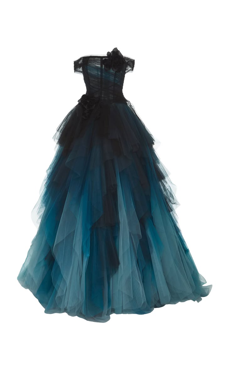 a strapless, ombre tulle ball gown is pictured on a white background. the gown transitions from black at the bodice to dark blue in the middle, then light blue near the bottom. it features two black floral embellishments: one on the bodice and another on the shoulder.