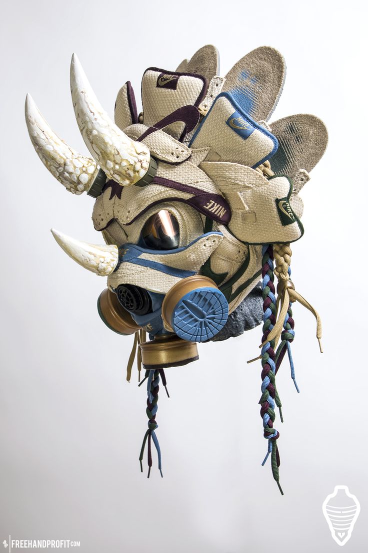 a closeup shot of an intricately crafted rhino sculpture, featuring an upcycled gas mask created from nike sneakers and other recycled materials. the sculpture is rendered in a color palette of white, brown, blue, and gold. the intricate details of the sculpture, including the horn, the snout, and the eyes, are all created from recycled materials.