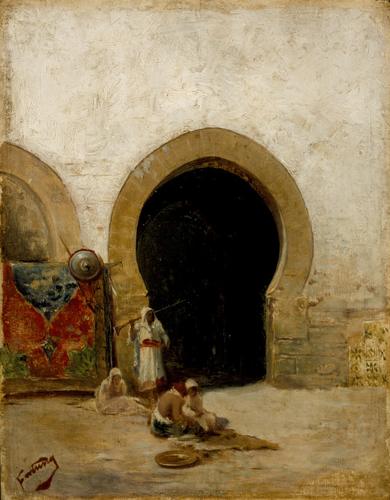the painting depicts a scene in what appears to be a moroccan or north african setting, showcasing elements of orientalism. an archway with a moorish style is prominent, leading into a dark opening. several figures are present: a standing guard dressed in white carrying a long object, and several seated people in the foreground, possibly engaged in a meal, as a plate is visible. a colorful tapestry hangs near another archway to the left. a shield is mounted above the tapestry. the overall style suggests a focus on local culture and architecture, typical of orientalist art.