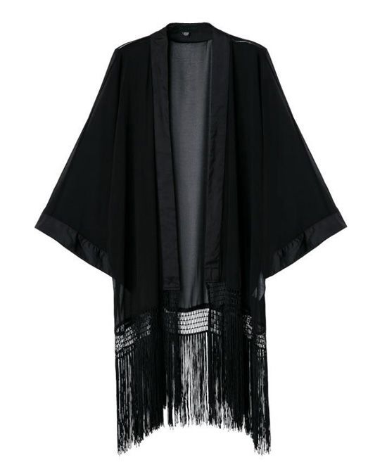 a black, sheer kimono with fringe detail on the bottom is displayed against a white background. the kimono has an open front and wide sleeves. it appears to be made of a lightweight fabric.