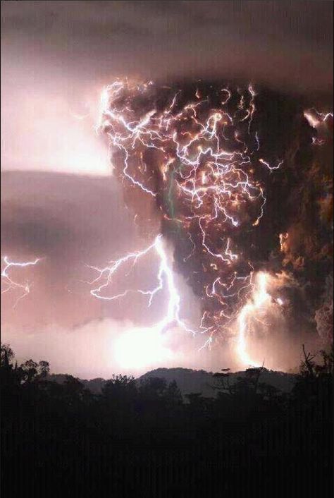 a breathtaking and powerful image of a volcanic eruption, captured during a fierce thunderstorm. the dark, ashladen cloud billows skyward, illuminated by brilliant flashes of lightning that snake through the sky. the sheer intensity of the event is palpable, creating a scene both aweinspiring and a little terrifying.
