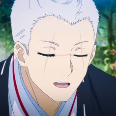 the image shows a closeup of an anime male character with white hair. he is smiling with his eyes closed. he is wearing a white shirt with a red tie and a blue jacket. he is looking down, and the background is blurred.