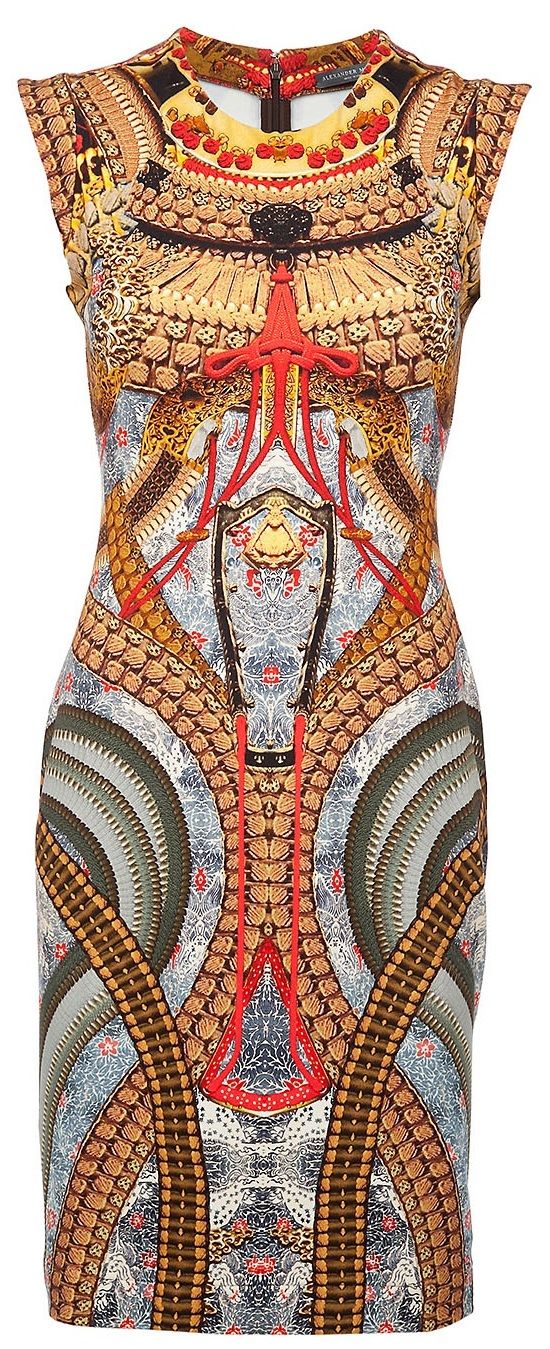this is an image of a woman's sleeveless dress with a beautiful, intricate patterned design. the dress is decorated with floral and tribal patterns in shades of red, gold, blue, gray, beige, and white. the design appears to be inspired by a silk print with a slightly retro vibe. this dress would be perfect for a summer or spring occasion.
