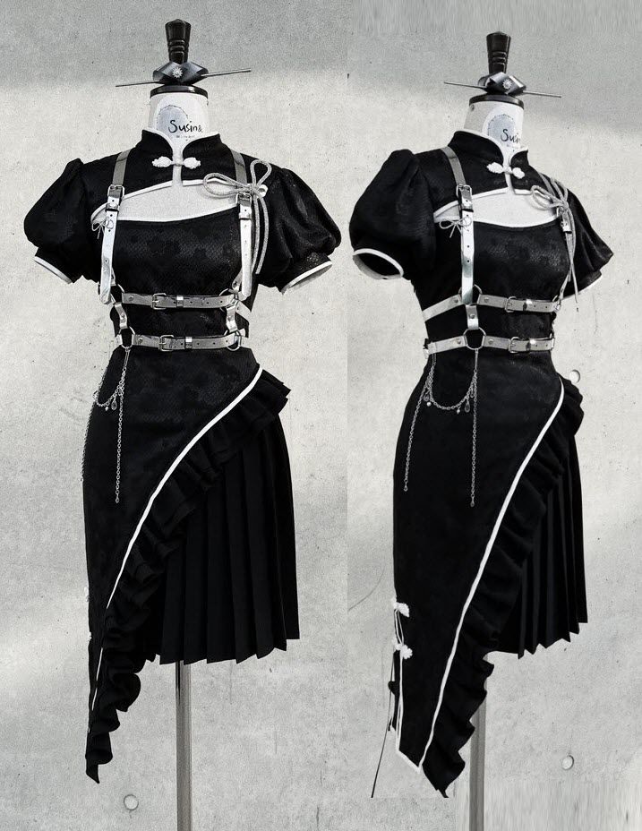 this image showcases two mannequins dressed in the same black dress with white trim. the dress features a halter top with a black bodice and a pleated, asymmetrical skirt. the mannequins are positioned side by side, facing forward. the dress has a distinct harajuku or gothic style, accented with silver chains and buckles. the mannequins are posed on white platforms and the backdrop is a gray wall, which provides a neutral background for the clothing. the image is taken in a studio setting and highlights the details of the garment.