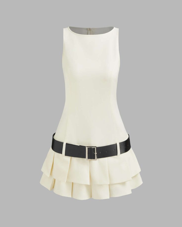 a white sleeveless dress with a black belt and a pleated skirt. the dress has a white collar.