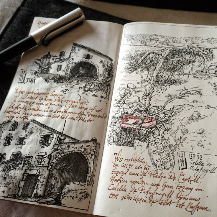 an open journal displays detailed sketches of architectural structures and natural landscapes. the left page showcases drawings of buildings with intricate stone arches, windows, and rooftops, accompanied by handwritten notes in the margins. the right page features a landscape drawing with a leaning tree, rocks, and what appears to be an abandoned boat, also complemented by handwritten text. a pen rests at the top of the left page, adding scale and indicating the sketching medium.