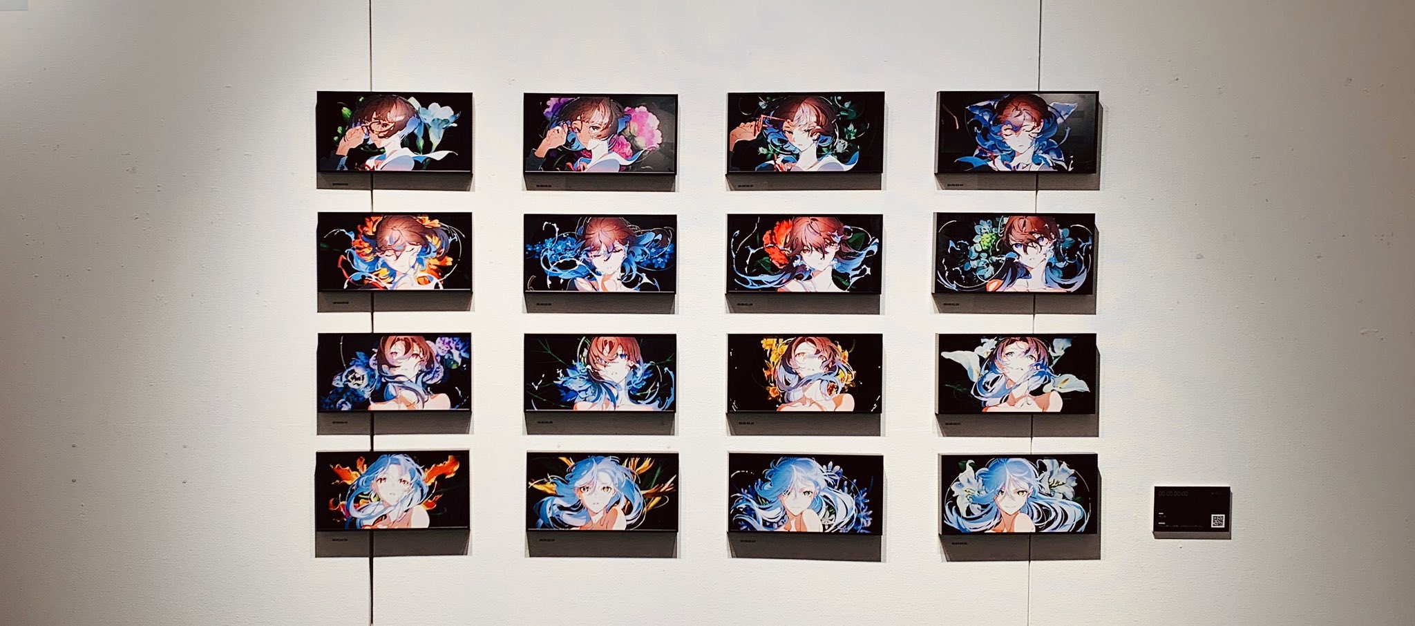 the image showcases an art exhibition featuring a grid of sixteen digital artworks. each piece portrays the same animestyle female character, her image consistently framed but set against varying abstract backgrounds of vibrant colors, primarily blue hues. the setting appears to be a modern, welllit gallery space, with the artworks mounted on a white wall.  the consistent framing and character create a sense of unity, while the diverse backgrounds introduce an element of variation and visual interest.