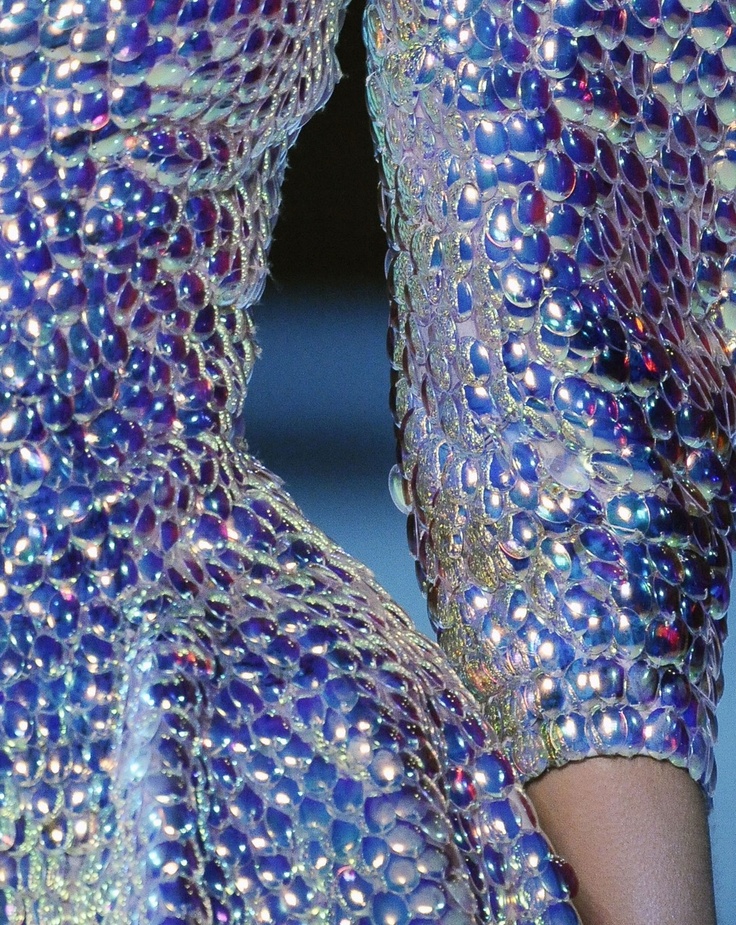 close up of a iridescent blue and silver sequins dress.