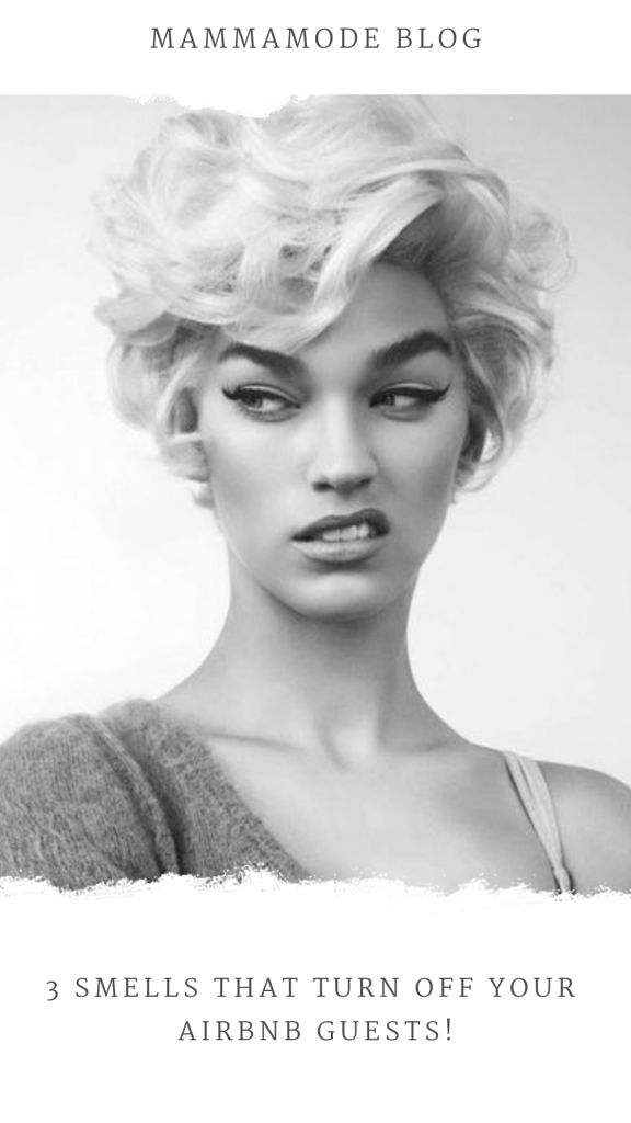 a black and white portrait of a young woman. she has short blond hair and is wearing a  simple outfit, a tank top. the image is focused on her face and she is looking directly at the camera with a neutral expression. she looks like she might be in a studio.  the lighting is soft and the background is neutral, bringing all attention to the woman's face.