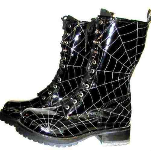 the image shows a pair of black patent leather boots with a spiderweb pattern. the boots are laced up and have a visible heel. they appear to be new and in good condition.