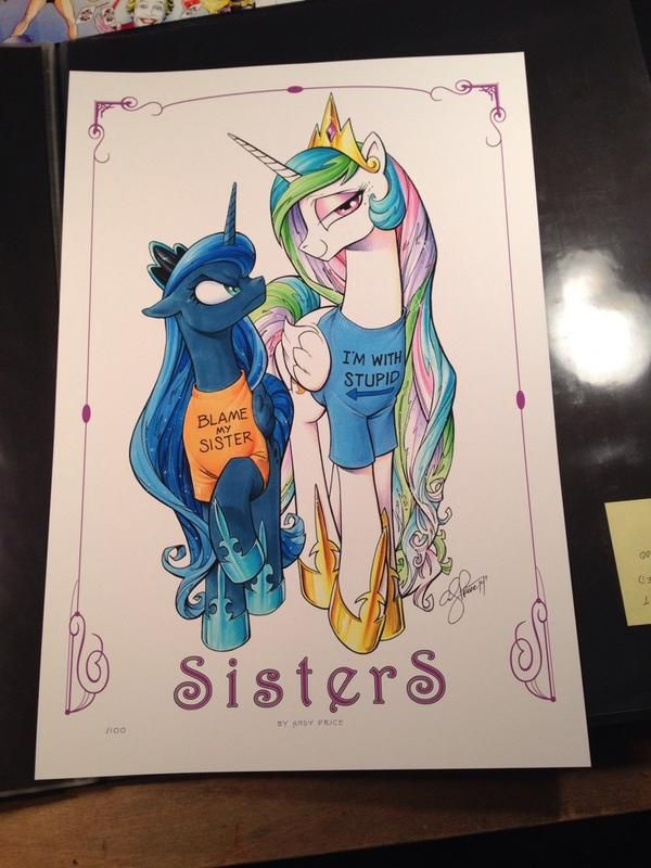 an image of a framed print featuring two my little pony characters, princess celestia and princess luna. they are depicted as wearing tshirts with humorous text: luna's shirt says "blame my sister" while celestia's says "i'm with stupid." the print is titled "sisters" at the bottom.