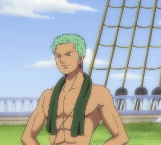 zoro from one piece, stands shirtless on the deck of a ship with his arms akimbo and a green towel around his neck. the weather is bright and sunny and the background features the mast and railings of the ship.