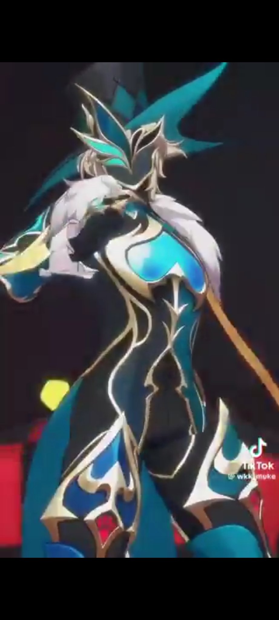 a cosplay character is shown in an anime style costume with blue, gold, and black accents. she's posing with a sword and has a large hat with wings.