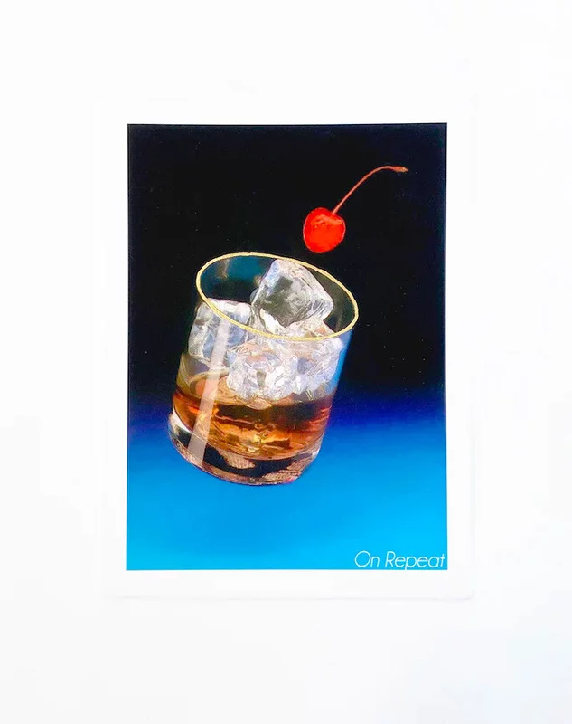 a close up shot of a glass of whiskey with ice and a cherry on a blue background. the glass has condensation on it. the text "on repeat" is in white text at the bottom of the image.