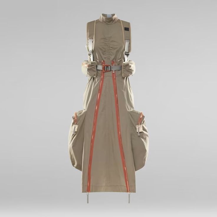 a beige dress with a futuristic design. it has multiple zippers running down the front of the dress, straps, and pockets on the sides. it is a unique and modern outfit. the background is grey and the dress is on a mannequin.