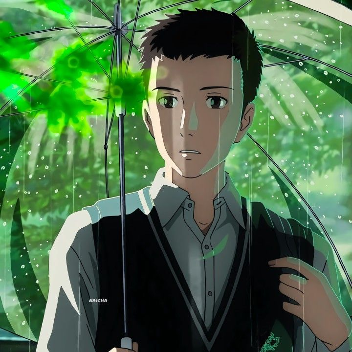 an anime boy with sad expression stands in the rain, looking down. he is holding a clear green umbrella, with the sunlight shining through it. rain droplets are falling around him, as he stands there thinking about something. he is wearing a school uniform. the background is a blurred, green, and wet forest.