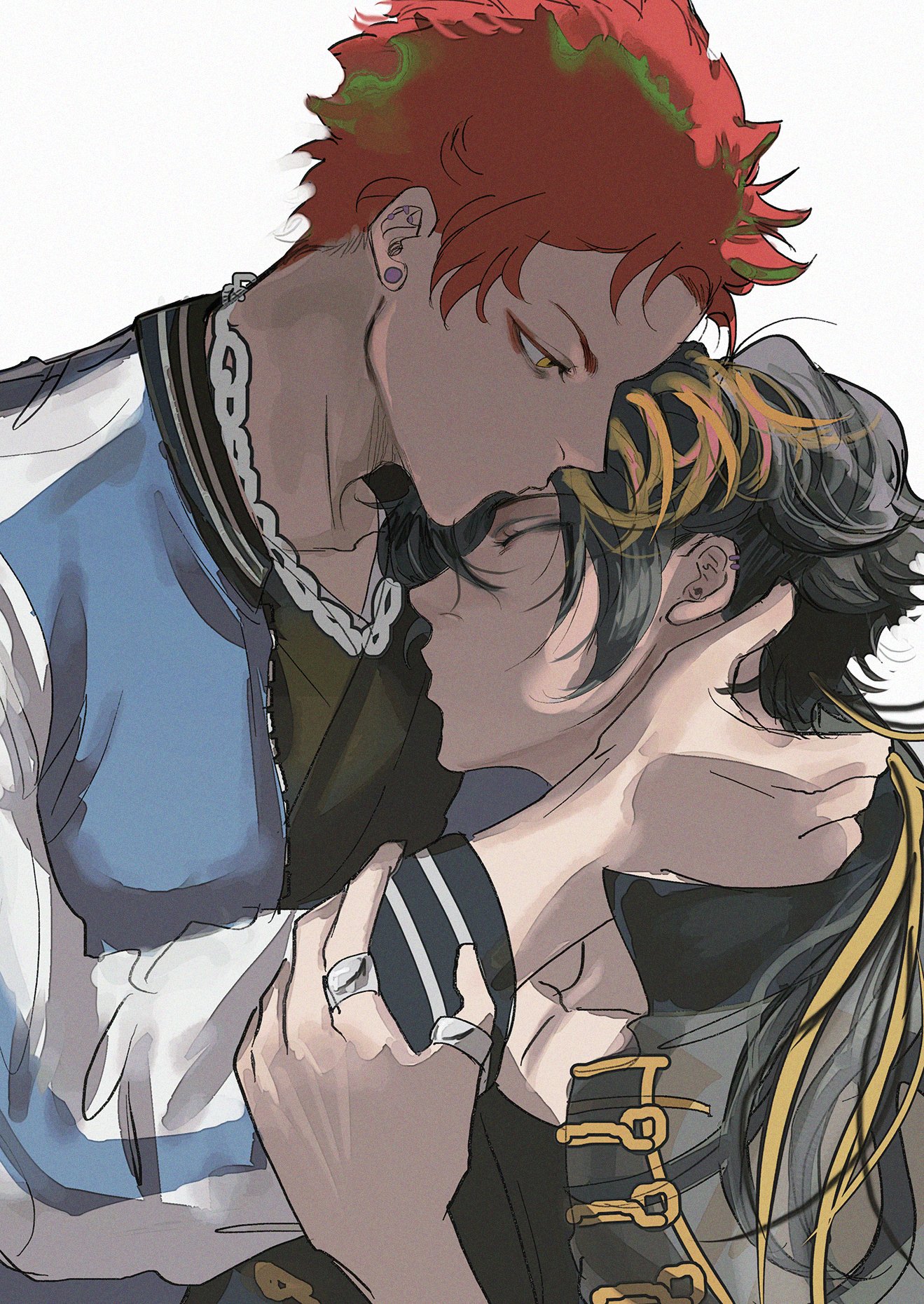 the image features two young men in an embrace. the one on the top is shown with red hair, a blue and white jacket and a chain necklace. he is