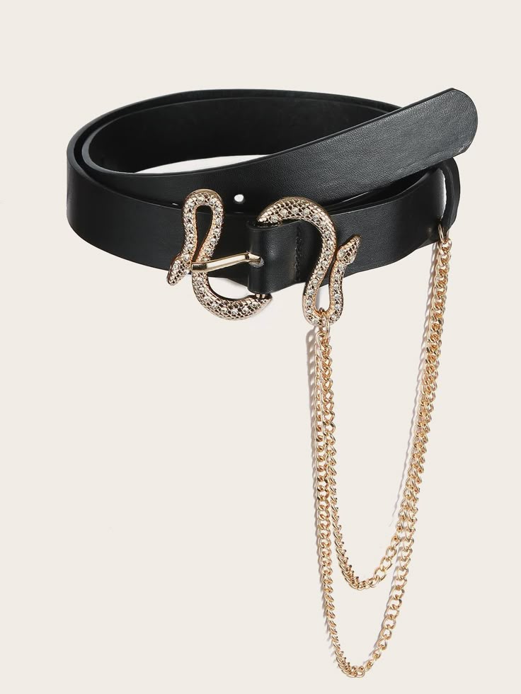 a black belt with a gold snake buckle and gold chains hanging from the buckle.
