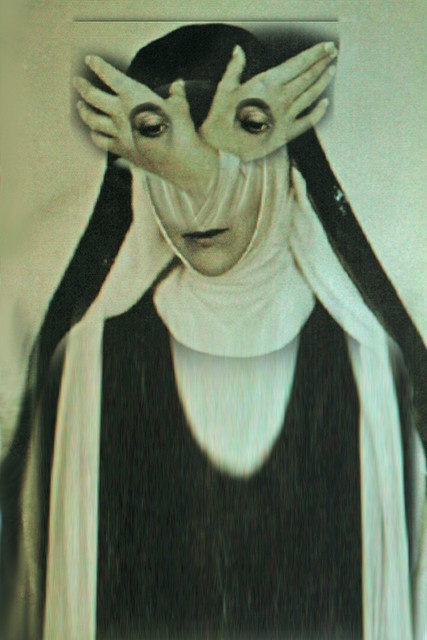 a woman wearing a black and white habit is pictured in a portrait. her face is partially covered by a white cloth, with the viewer only able to see her closed eyes.  a pair of hands are covering her face, almost as if she is trying to hide.  the image is in monochrome, creating a sense of mystery and spirituality.