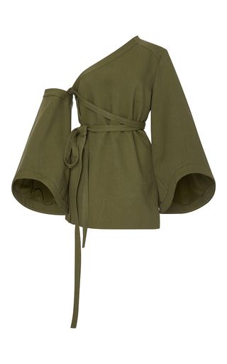 a stylish olive green oneshoulder wrap top is shown against a white background.  the top features long, wide sleeves and a selftie belt. the fabric appears to be a lightweight linen or cotton. the overall style is minimalist and loose fitting.