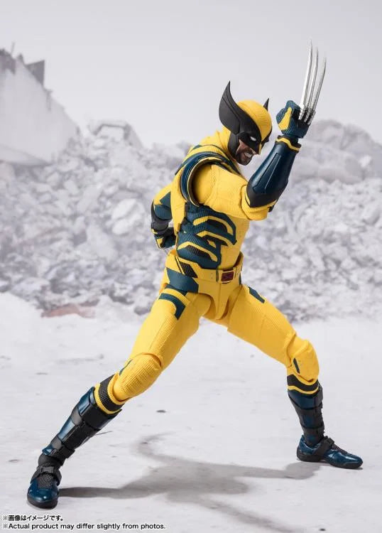 the image showcases a wolverine action figure clad in his iconic yellow and blue suit. he is positioned in a dynamic stance against a blurred backdrop of a snowy environment, suggesting a battle scene. wolverine's right arm is extended forward, with his adamantium claws unsheathed, while his left arm is raised in a defensive posture. his expression is fierce and determined. the figure is highly detailed, capturing the character's muscular physique and costume intricacies. the use of studio lighting enhances the figure's features and creates a sense of depth in the image. the low camera angle adds to the dramatic effect, making wolverine appear imposing and powerful.