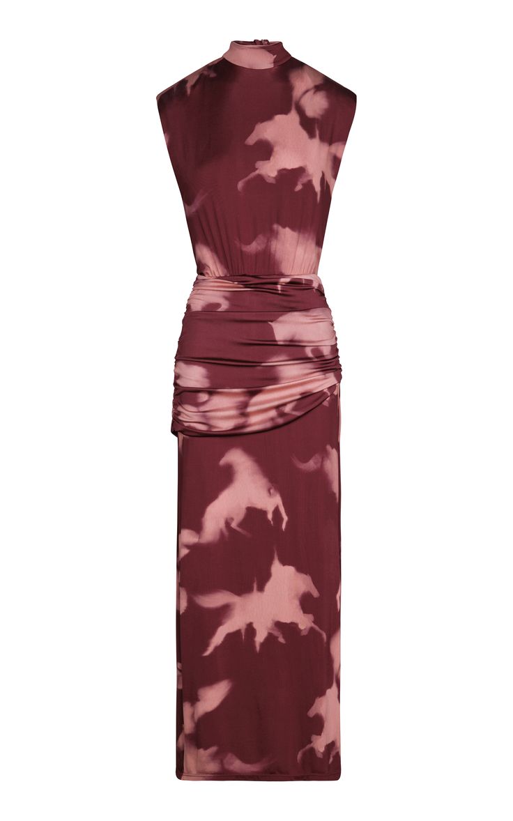 a red sleeveless maxi dress with a tie dye print. it has a high neck and is made of a stretchy material. the dress is perfect for a summer party or a night out.