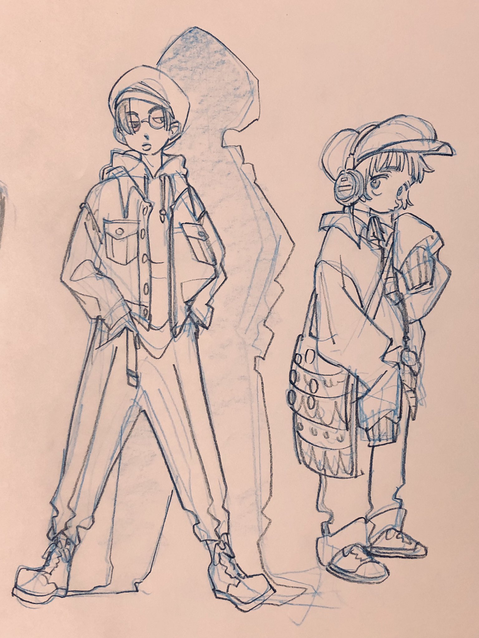this is a fashion illustration of two people, likely femalepresenting, in outfits with loose silhouettes. both wear hats and pants and have accessories. the person on the left wears round glasses and a denim jacket, while the person on the right wears headphones, a baseball cap, and a crossbody bag. the style is loose and expressive, with hatching and crosshatching used to add shading.