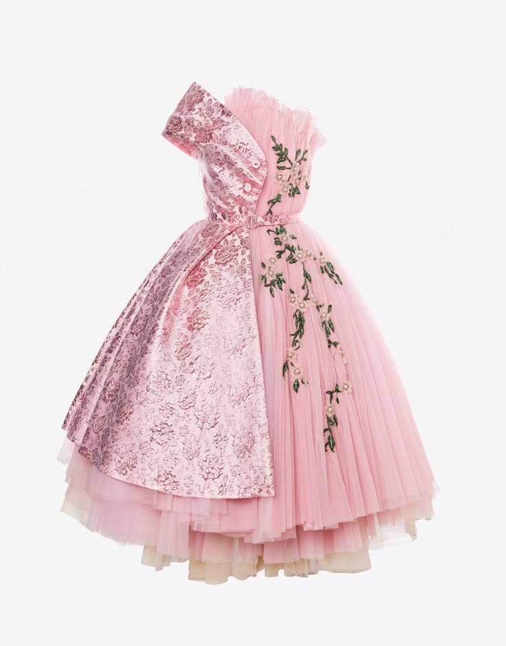 a oneshoulder pink dress is displayed against a white background. the dress features a unique design with a structured, floralpatterned panel on one side of the bodice and skirt, contrasting with a flowing, tulle skirt on the other side adorned with delicate floral embroidery and pearl accents. the skirt is multilayered, giving it volume and depth. the top of the dress has a ruffled neckline.