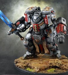 a meticulously painted miniature of a space marine in terminator armor from the warhammer 40,000 universe. the miniature is dynamically posed, wielding a power sword in its right hand and a storm bolter mounted on its left arm. the armor is predominantly grey with red accents, and the miniature stands on a textured base decorated to resemble a battleground.