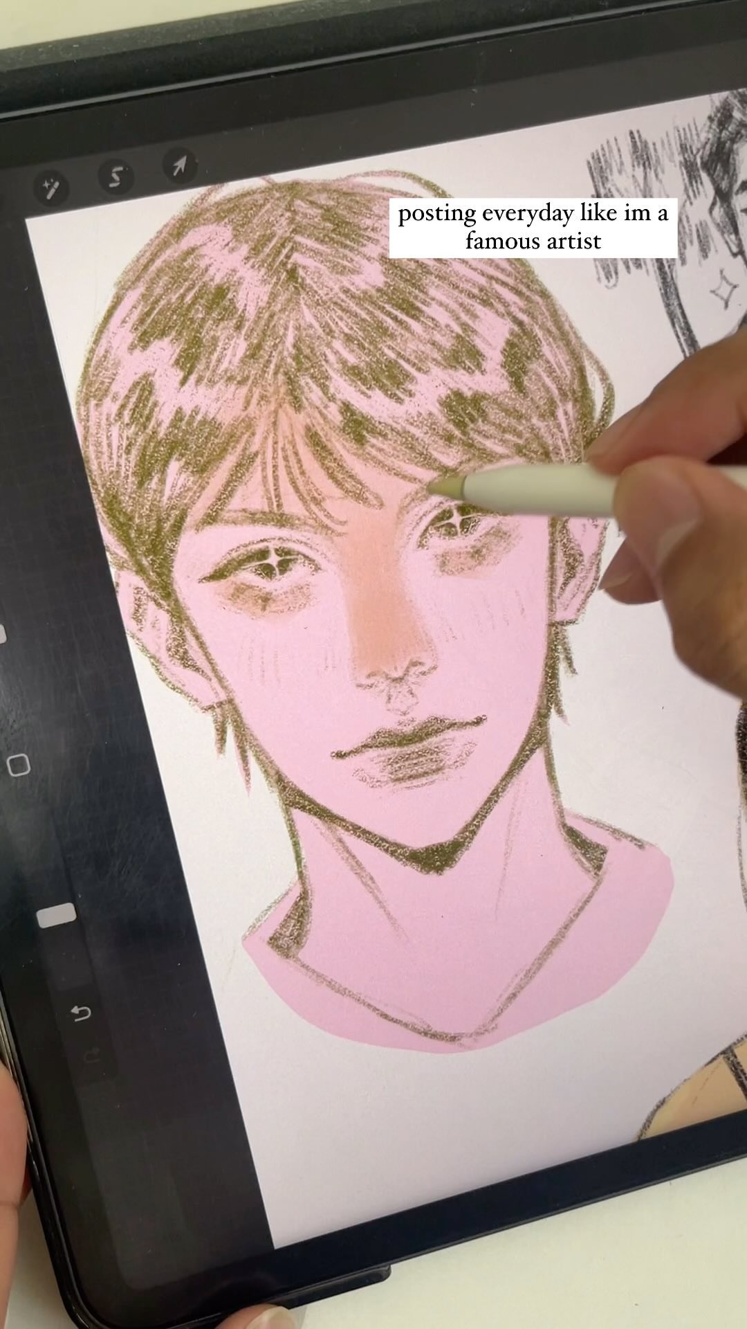 closeup view of a hand using a stylus on a digital drawing tablet to create a portrait illustration. the illustration is a stylized portrait of a young person with soft, pastelcolored features. the text "posting everyday like im a famous artist" is visible on the screen, suggesting the context of the image. the overall aesthetic is modern and artistic.