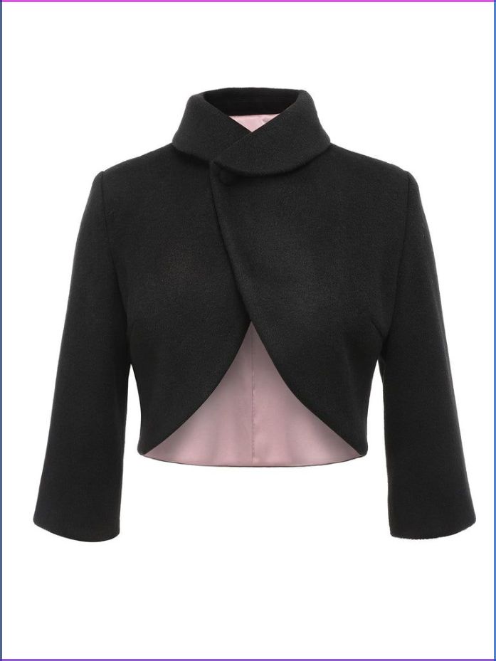 a black cropped bolero jacket with long sleeves and a collar. the jacket is made of a soft fabric and has a smooth finish. it is a versatile piece that can be dressed up or down, and is perfect for adding a touch of elegance to any outfit. the jacket is shown against a white background.
