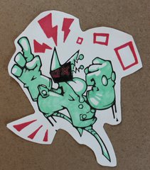 a cartoon character drawn on white paper with green skin, red gloves, and a red and black helmet. the character appears to be in a fighting stance. the background is white with red and black shapes surrounding the character.