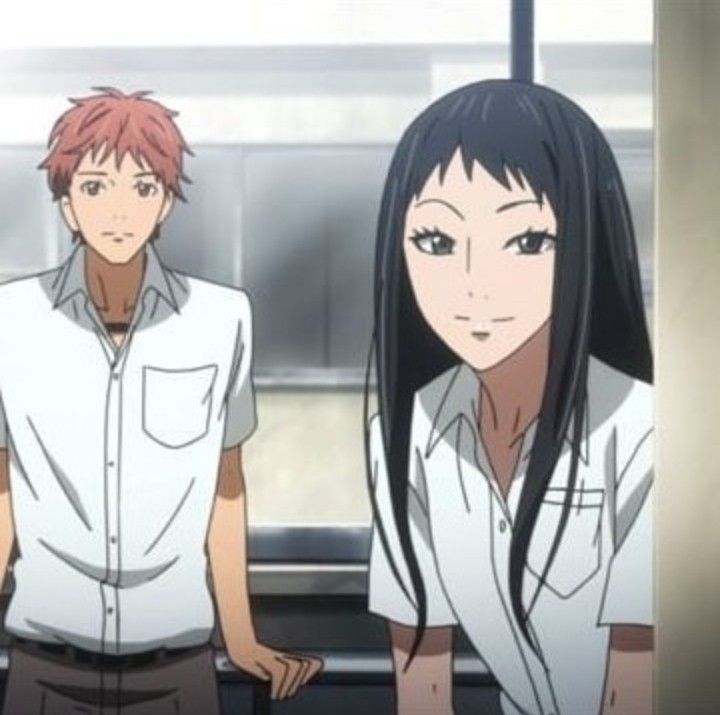 the image shows a young man with brown hair and a young girl with long black hair. they are both in school uniforms, and the girl is smiling and looking to the side while the boy is looking at the camera. they are both standing side by side.