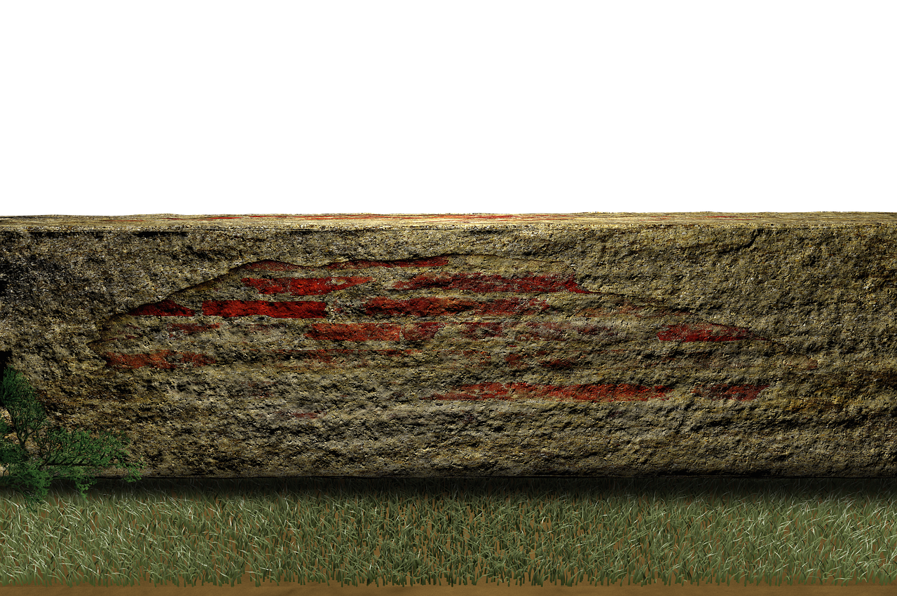 a closeup of a stone wall with red stripes in a textured pattern, set against a black background. green grass grows at the base of the wall on a brown ground.