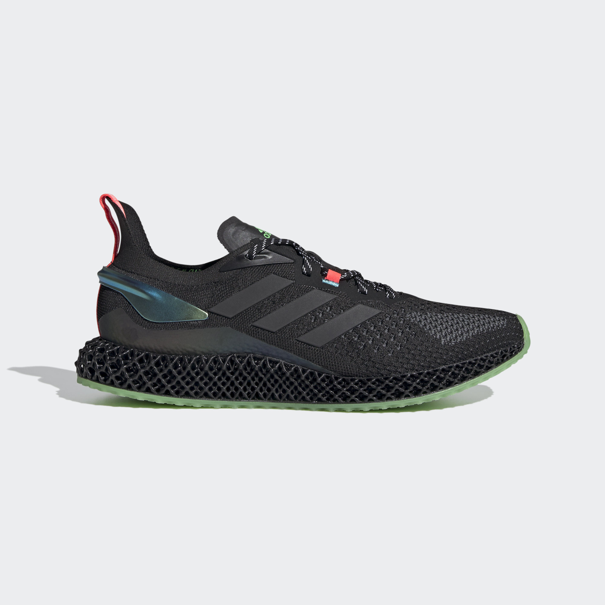 a side view of a black adidas running shoe with green accents on a white background.