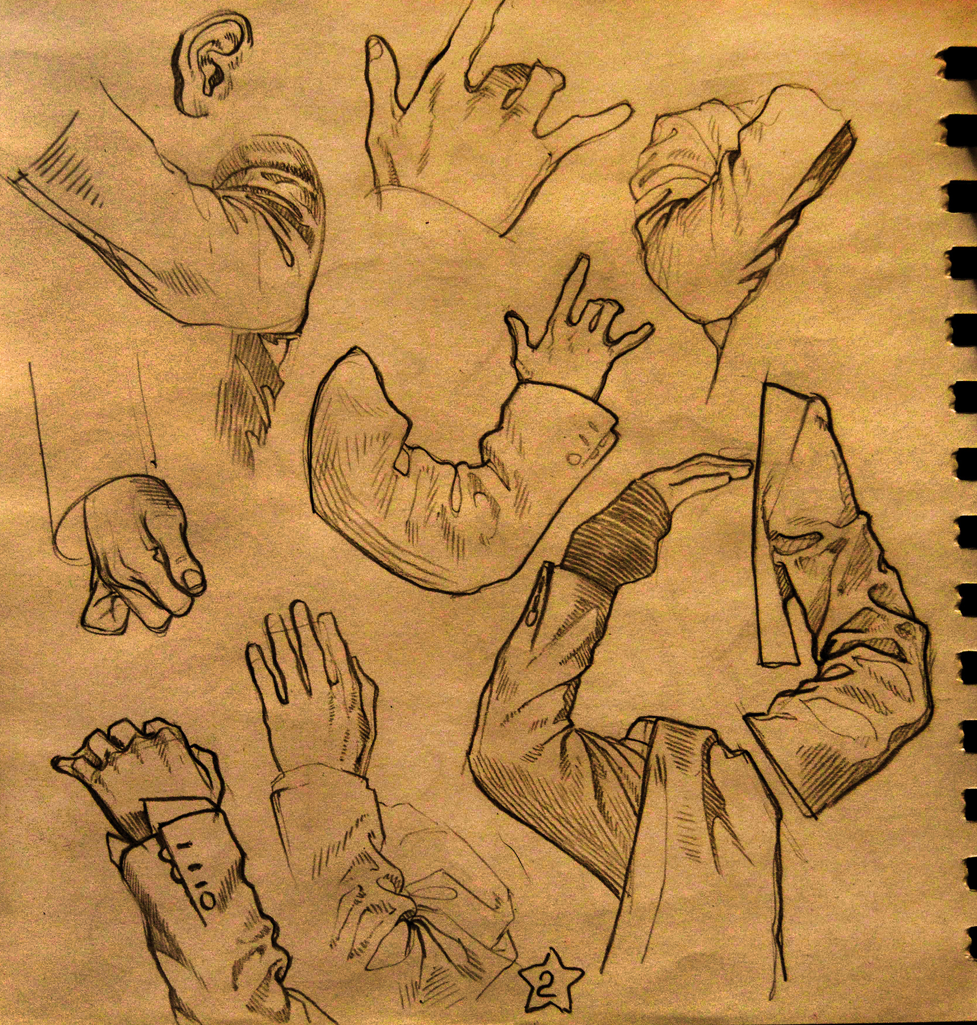 the image is a page from a sketchbook filled with anatomical sketches of arms and hands in various poses. all of the sketches are in pencil on tan paper. most of the hands are shown with sleeves. the drawings appear to be practice sketches, focusing on form and gesture.  there is an ear drawn on the top left of the page as well.