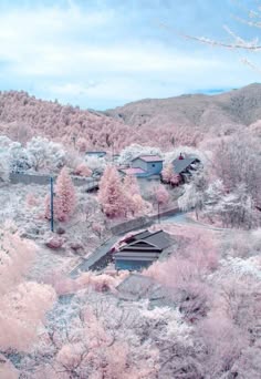 a picturesque winter landscape unfolds, showcasing a breathtaking vista of snowcovered mountains, dense forests cloaked in a delicate layer of pink blossoms, and quaint houses nestled amidst the snowy terrain. the scene is bathed in a soft, pastel hue, creating an ethereal and enchanting atmosphere. the delicate beauty of the blooming trees, the serenity of the snowcovered landscape, and the tranquil ambiance evoke a sense of peace and tranquility. the entire image feels like a whimsical fairytale, inviting the viewer to step into a magical realm where dreams take flight.