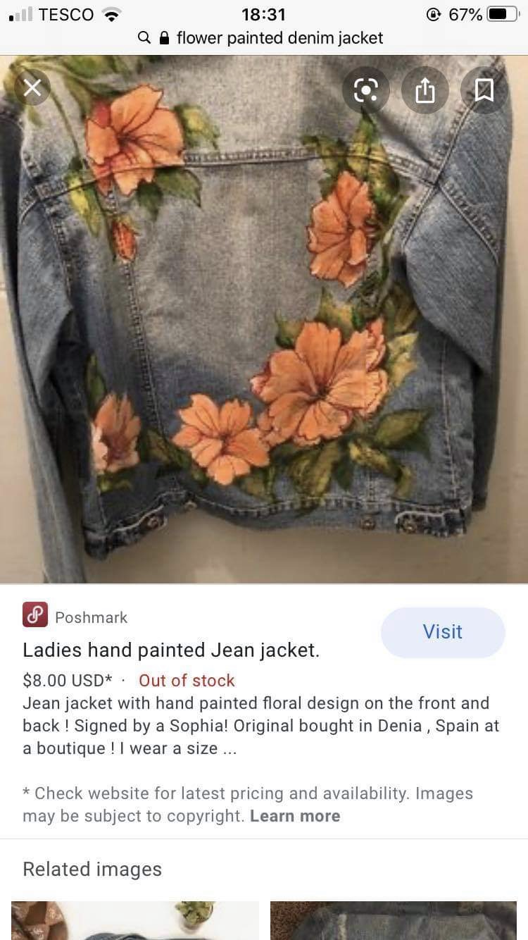 a denim jacket with handpainted orange and yellow floral designs on the front and back is displayed against a white background in an online shopping app. the jacket is listed as out of stock.