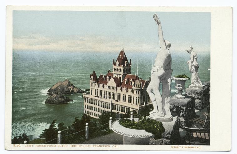 this image is a vintage postcard depicting the cliff house from sutro heights in san francisco, california. the scene includes a large building resembling a castle or ornate hotel, located near the ocean. in the foreground, there are two statues on a cliff overlooking the ocean. the postcard is marked with "8136. cliff house from sutro heights, san francisco cal." and "detroit publishing co."