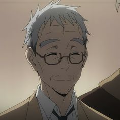 the image shows a closeup portrait of an elderly man from an anime. he has short, graying hair, kind brown eyes, and wrinkles around his eyes and mouth. he wears round glasses and a small smile, conveying a sense of warmth and serenity. he's dressed in a light brown suit jacket over a white shirt and a dark tie. the background is a neutral beige, keeping the focus on the man's gentle expression. the overall feel of the image is calm and pleasant.