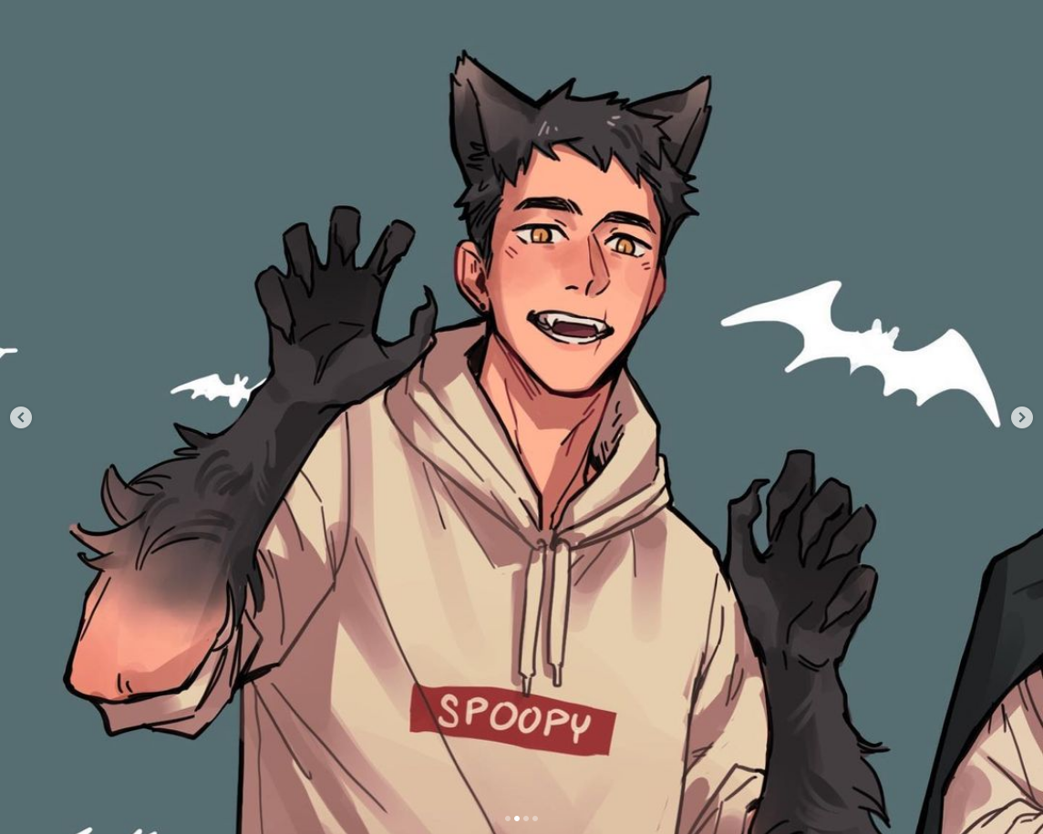 a young man in a halloween costume. he's wearing a beige hoodie that says "spoopy" with werewolflike arms and hands, and black cat ears on his head. he has sharp teeth and is smiling with his hands up. the background is a bluegray with two white bats.