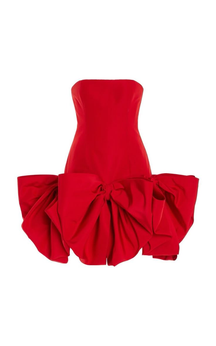 a bright red strapless dress with a large decorative bow on the skirt.