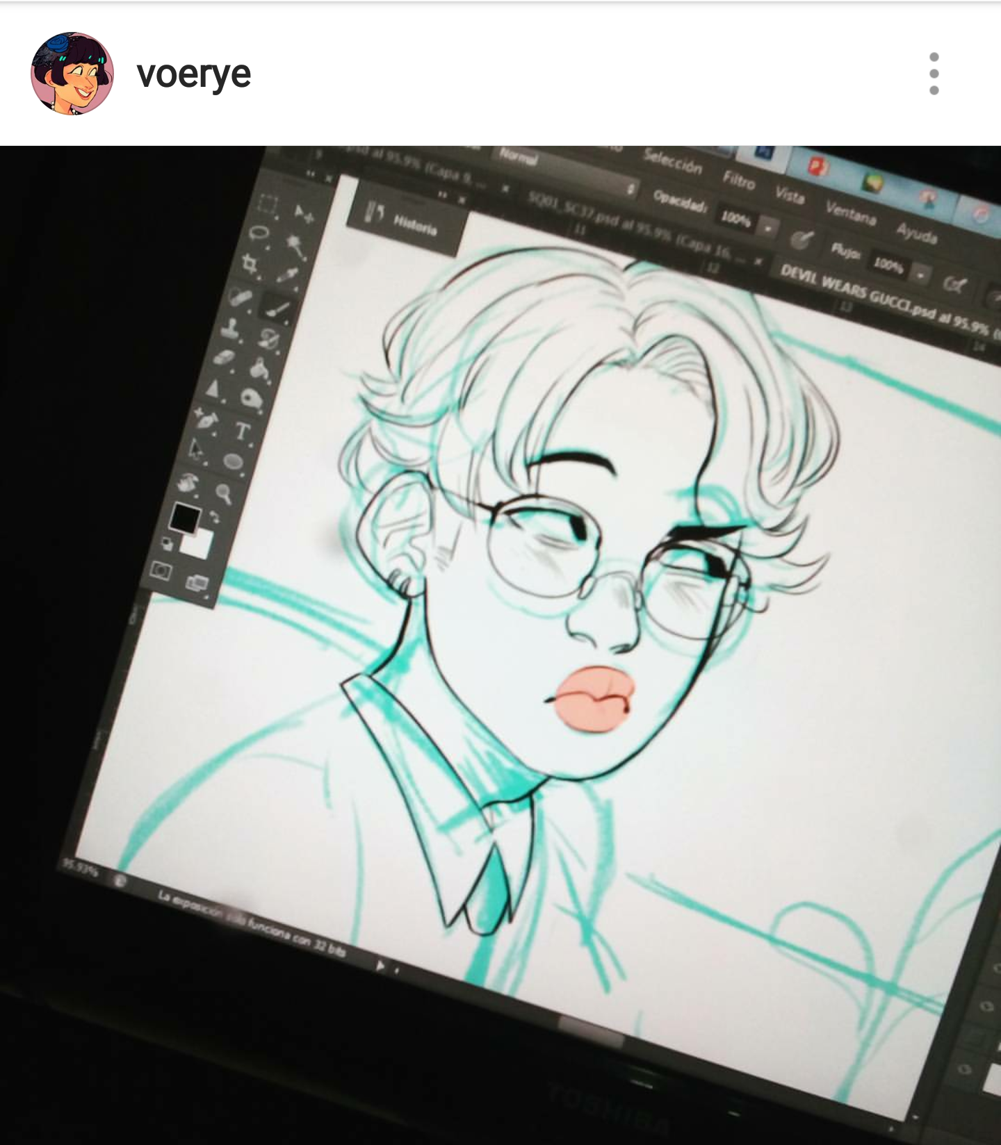a digital drawing of a person with glasses and pink lips is displayed on a computer screen. the drawing is in a cartoon style and appears to be a portrait. the art program interface is visible around the drawing.