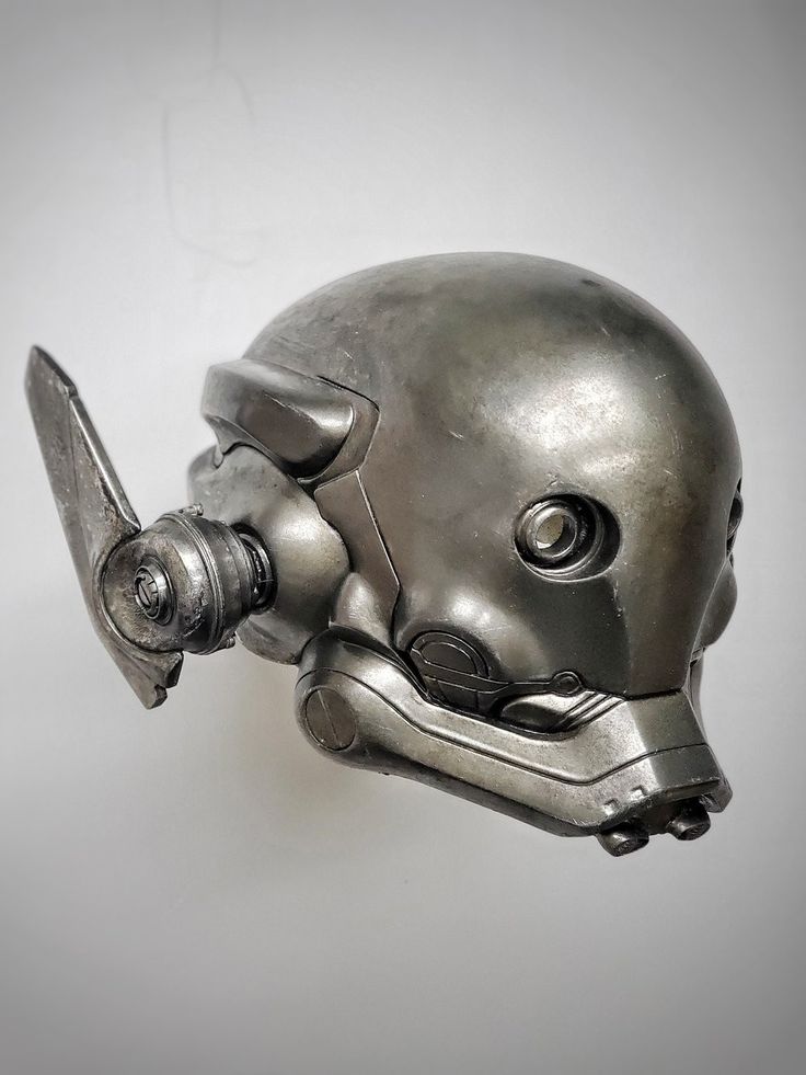 a close up shot of a detailed silver robot helmet with futuristic design and metallic details.