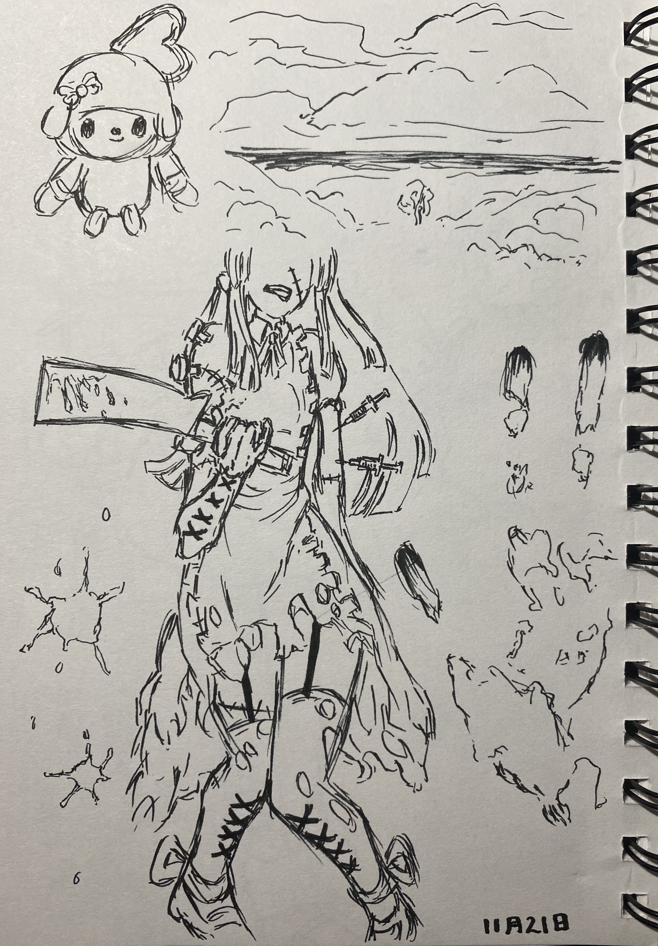 he image is a sketchbook page featuring several ink drawings. the main focus is on an animestyle girl character with long hair, wearing a tattered dress and seemingly wielding a large, damaged blade.  she is adorned with stitches and syringes, suggesting a damaged or perhaps undead aesthetic.  other elements include a small drawing of my melody (the sanrio character), a simple landscape sketch showing a cloudy sky and a body of water, and some abstract ink blots. the style is expressive and sketchy, with a mix of detailed character work and loosely rendered background elements.  the overall mood is somewhat dark and fantastical.  the date "11a218" is visible in the lower right corner.