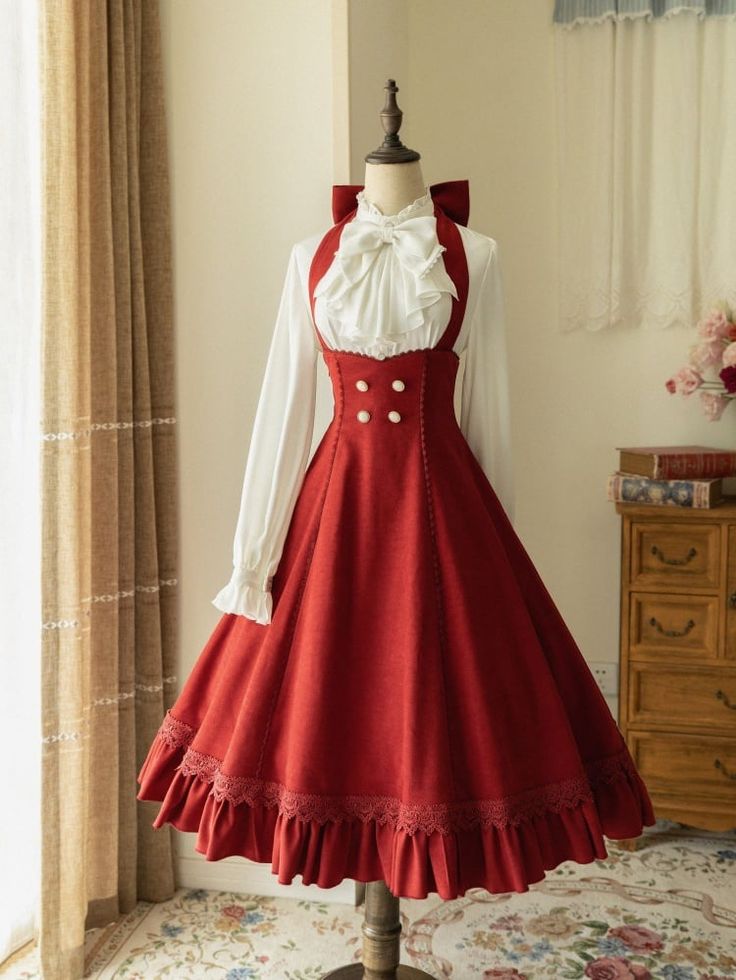 a fulllength image of a red dress on a mannequin. the dress is in a vintage style with a white blouse worn underneath. the image is welllit and shows the dress in detail.