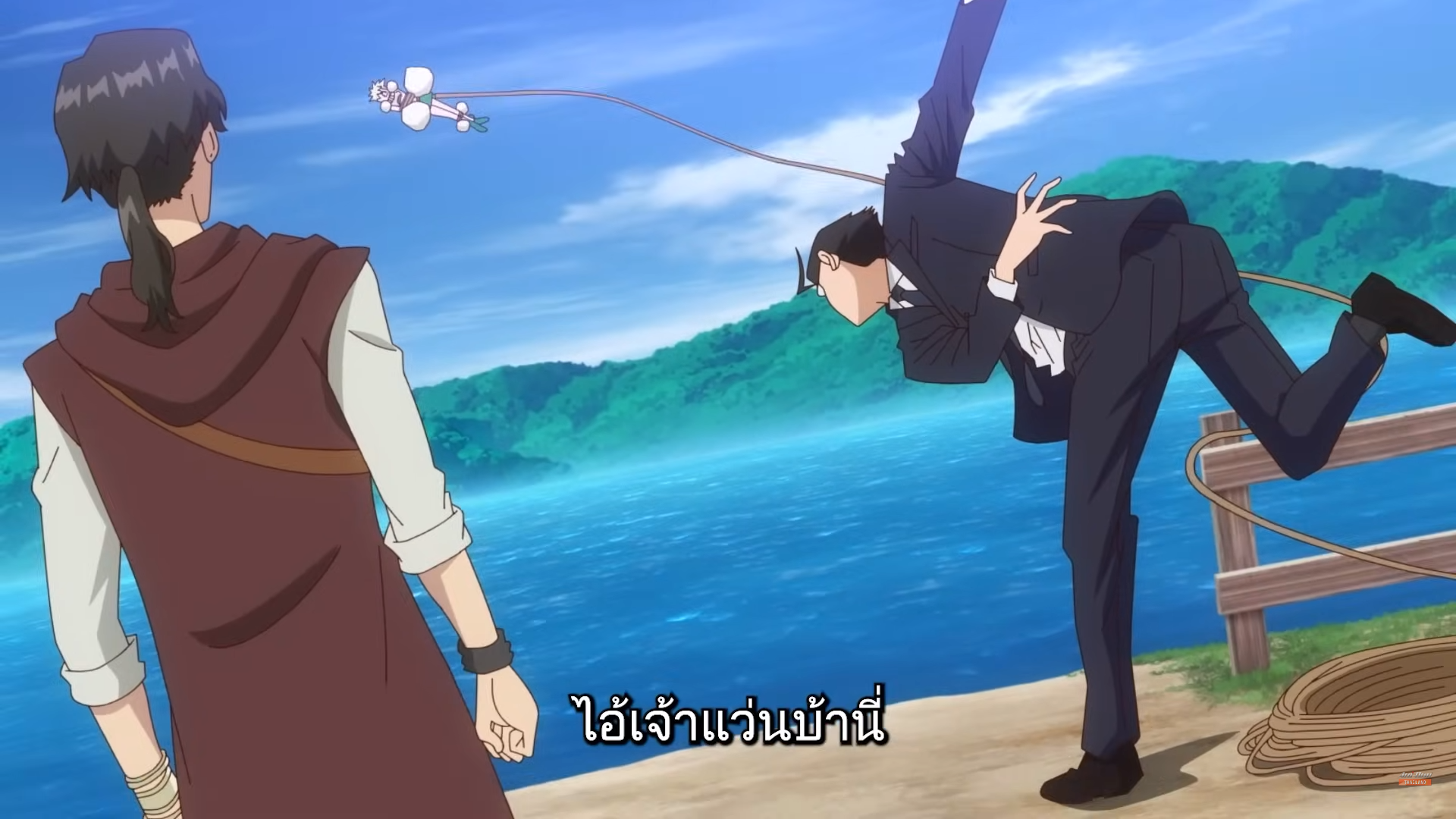 the image shows a scene from an anime, likely a comedic fight. a man in a brown vest is facing away from the viewer, seemingly having just used a rope to yank a businessman off his feet. the businessman is midair, his body contorted comically as he's pulled by the rope. they are on a grassy beach with a rope fence, with blue water and green mountains in the background. the overall lighting is bright and sunny.