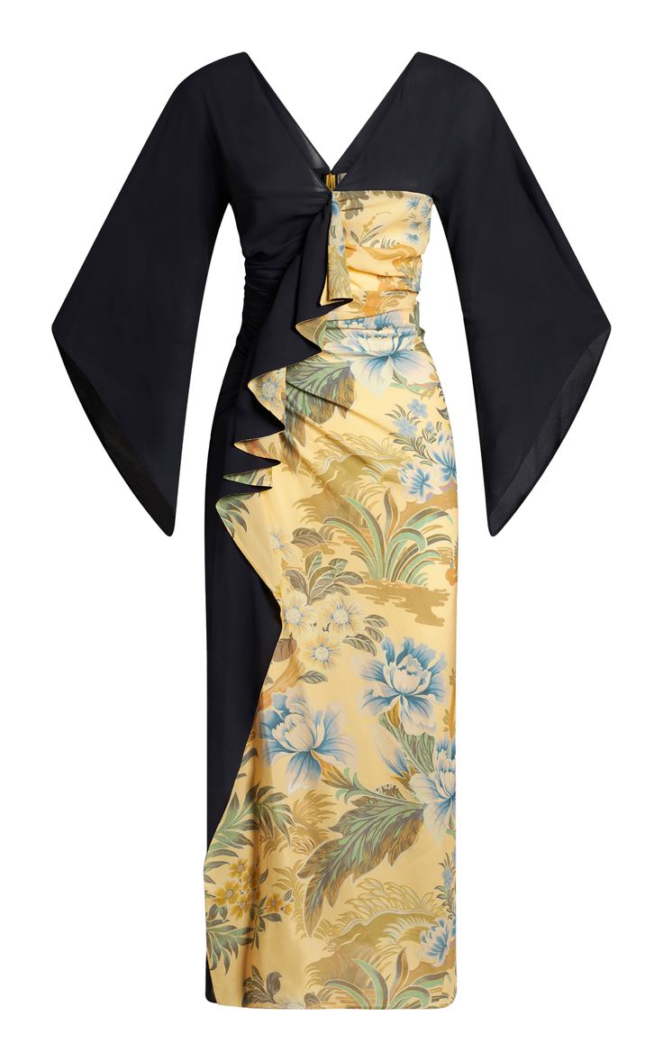 a long, elegant dress with a black bodice and flowing floral print skirt. the dress has a ruffled neckline and long sleeves, which are black and flowy. the dress is made of a highquality fabric that feels soft to the touch and drapes beautifully. the dress is perfect for a special occasion or a night out.